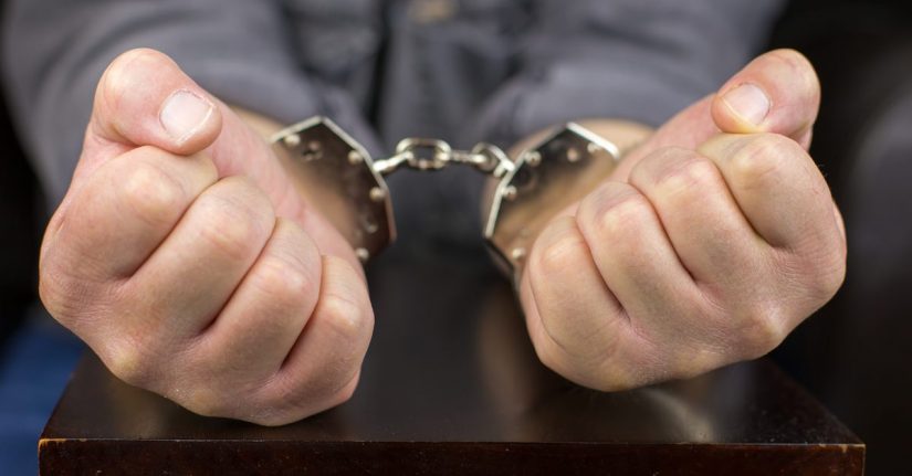Photo of a Man in Handcuffs