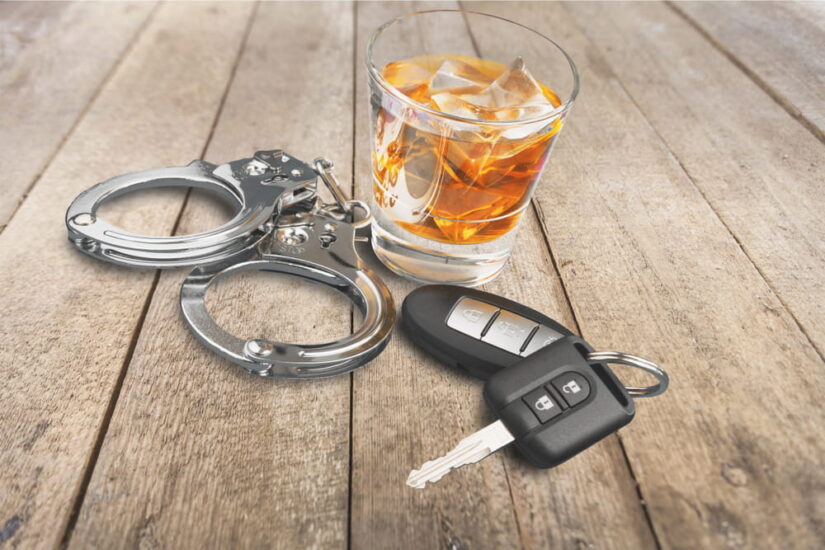 Keys With Handcuffs And Alcohol