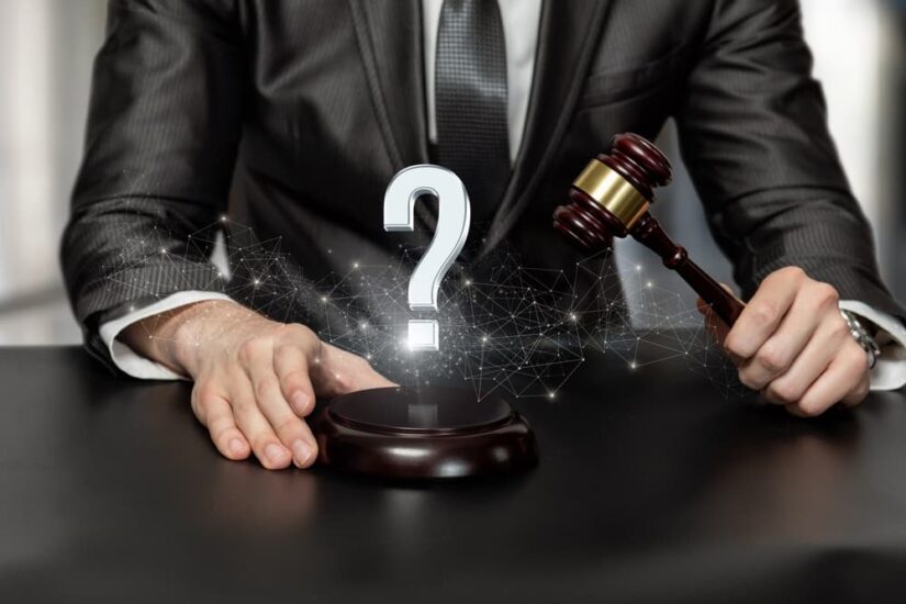 Criminal Lawyer holding judge's gavel and question mark shown in graphics
