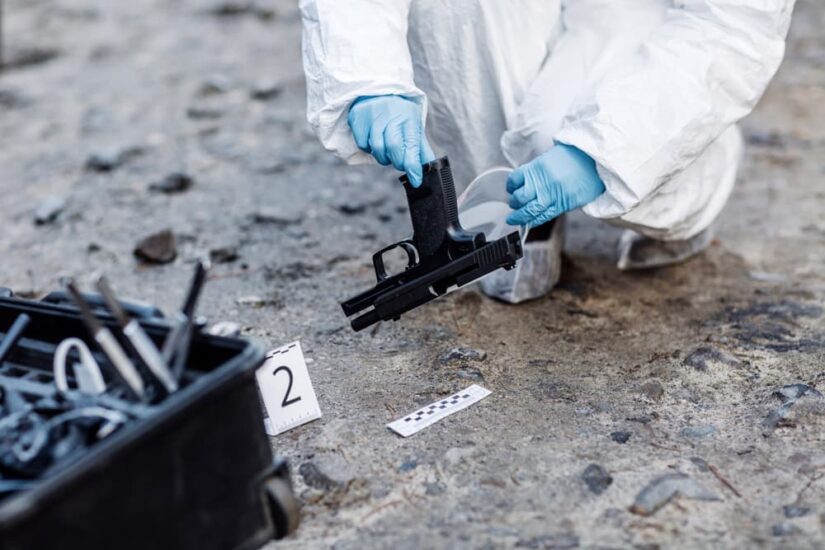 Criminological expert collecting evidence at the crime scene.